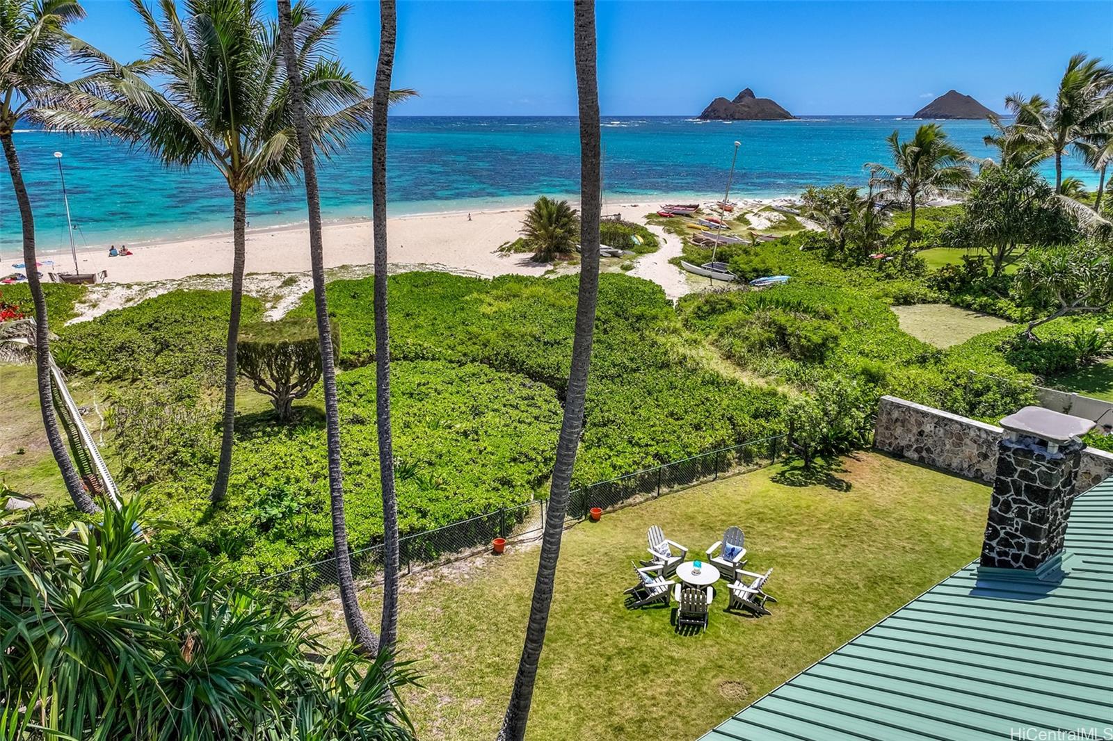 942 Mokulua Drive is located on the wide sandy part of Lanikai Beach.