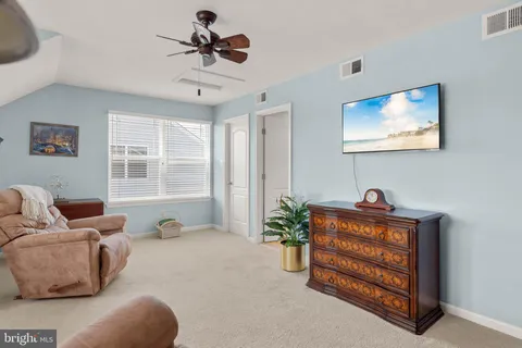 a view of swimming pool with a barbeque and wooden stairs