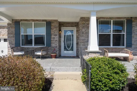 a room with pool table and windows