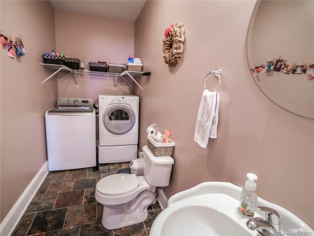 2789 Bush Road Clover, SC 29710 - Photo 13 of 24 a bathroom with a toilet a sink and mirror