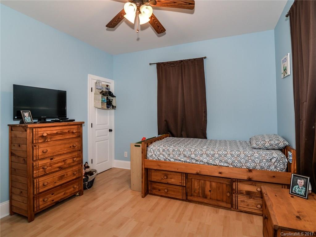 2789 Bush Road Clover, SC 29710 - Photo 17 of 24 a bedroom with a bed and wooden floor
