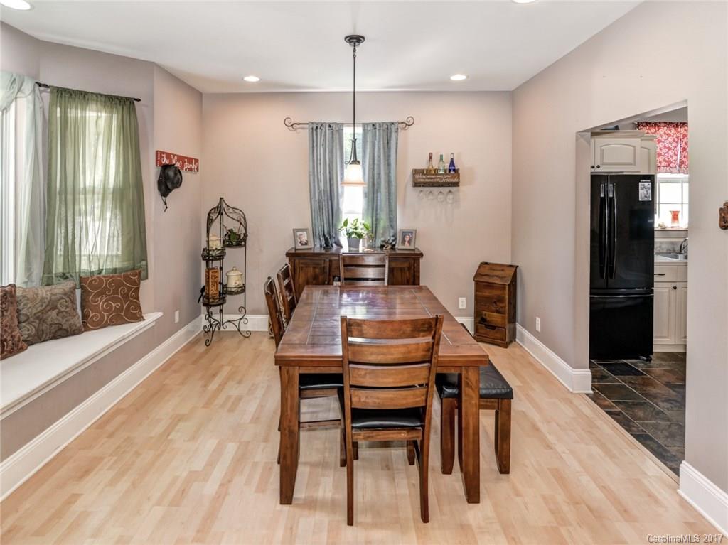 2789 Bush Road Clover, SC 29710 - Photo 5 of 24 a dining room with furniture a chandelier and wooden floor