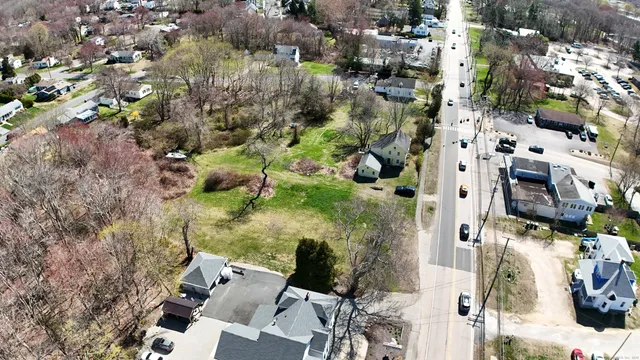 a view of a backyard with plants and a patio