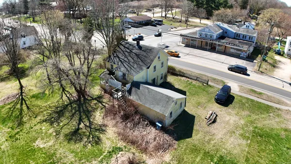 a view of a yard with a tree