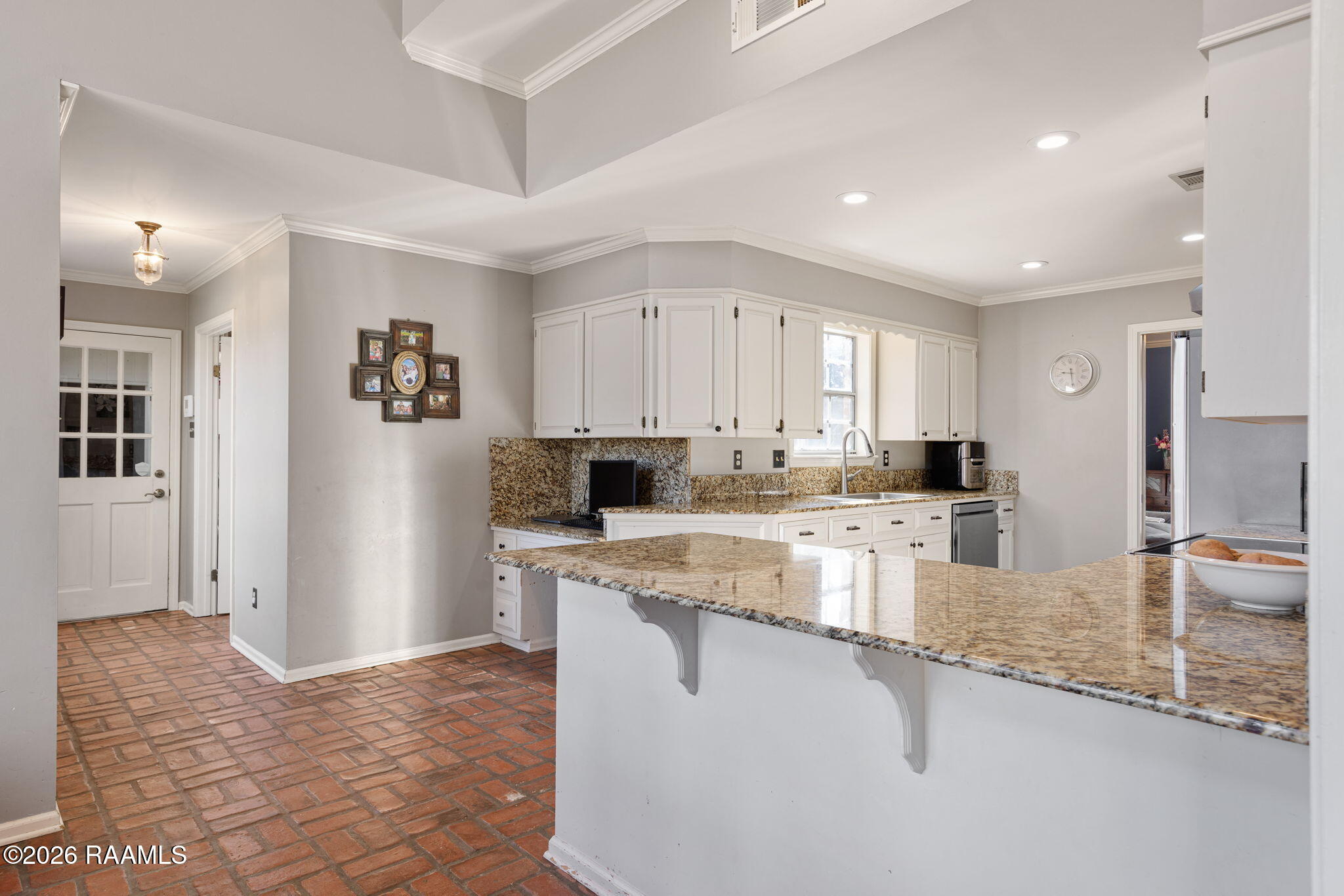 407 Kilbourne Circle Carencro, LA 70520 - Photo 10 of 27 Garage Hallway | Computer Nook | Kitchen