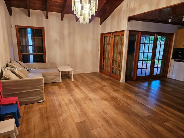 a living room with furniture and entry gate