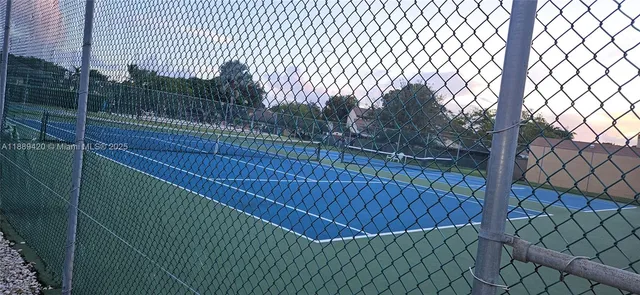 a view of balcony with wooden fence