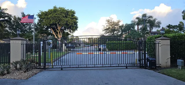 a view of a wrought iron fences in front of house