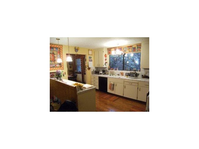 4077 Crest Road Pebble Beach, CA 93953 - Photo 6 of 8 a kitchen with a sink and cabinets