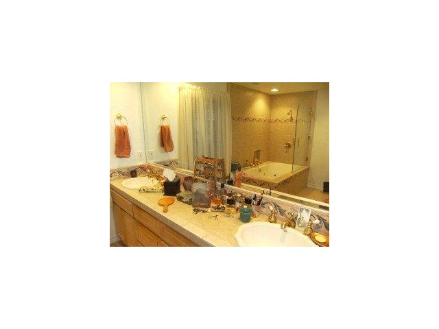 4077 Crest Road Pebble Beach, CA 93953 - Photo 8 of 8 a bathroom with a sink mirror and a bathtub