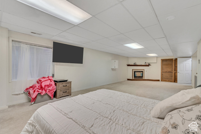 1225 North 1380th Street West Mapleton, UT 84664 - Photo 16 of 18 Bedroom with carpet flooring, a drop ceiling, and a fireplace with raised hearth