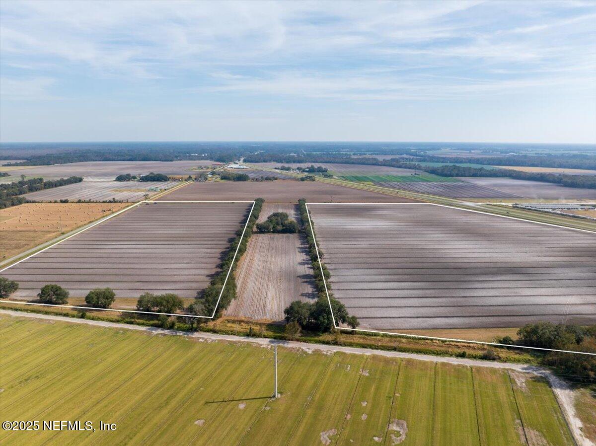 0 State Road 207 Hastings, FL 32145 - Photo 6 of 8 a view of a swimming pool with a yard