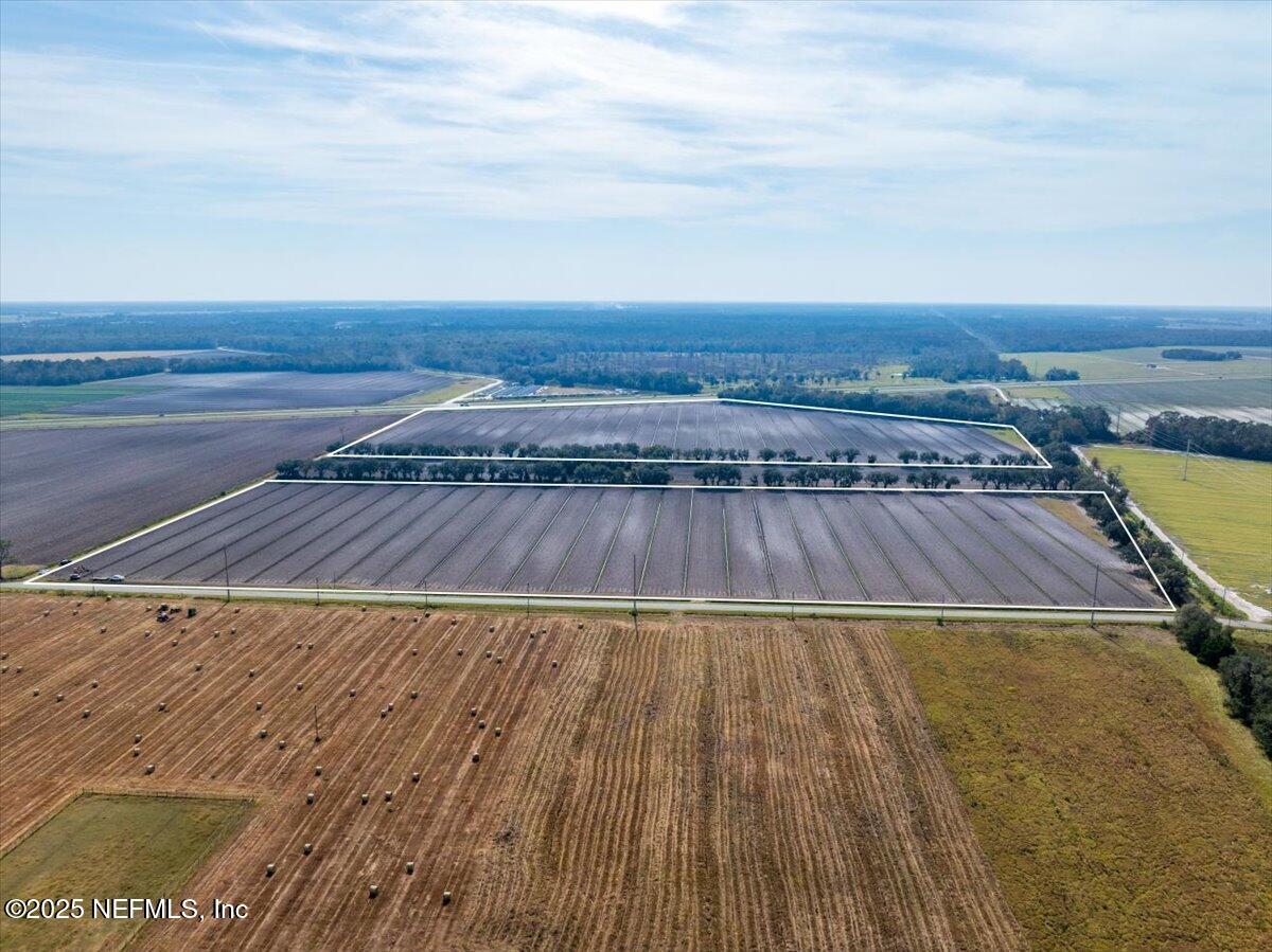 0 State Road 207 Hastings, FL 32145 - Photo 8 of 8 an aerial view of residential houses with wooden floor