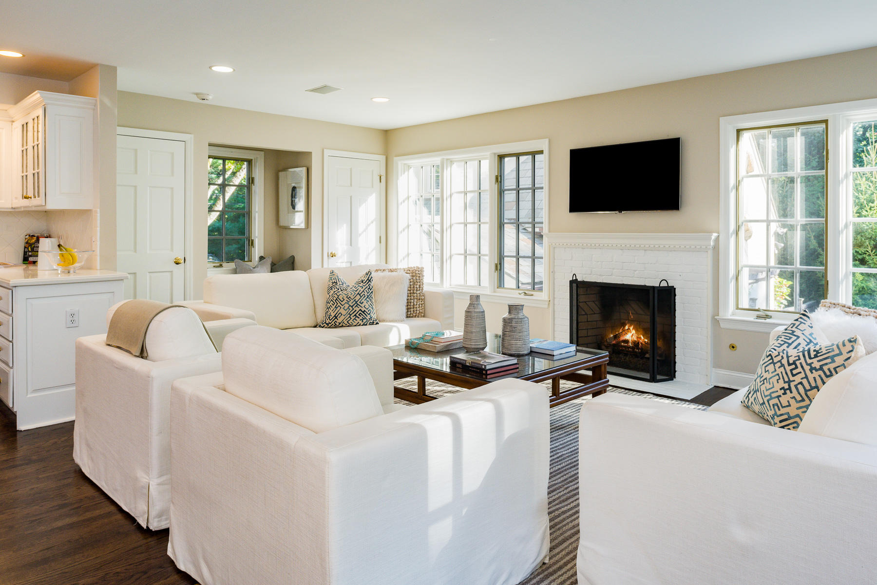 10 Meadowbrook Road Darien, CT 06820 - Photo 11 of 42 a living room with furniture a fireplace and a flat screen tv