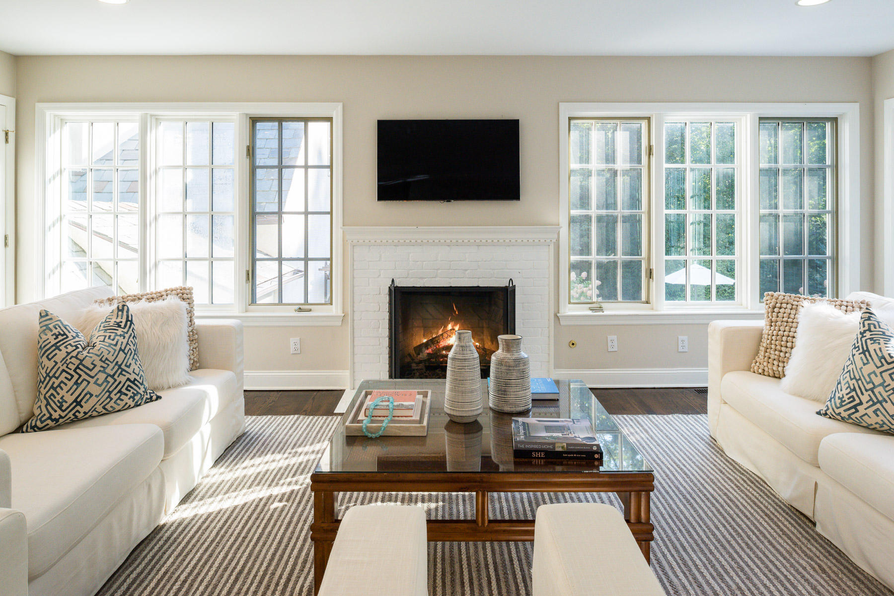 10 Meadowbrook Road Darien, CT 06820 - Photo 12 of 42 a living room with furniture a flat screen tv and a fireplace