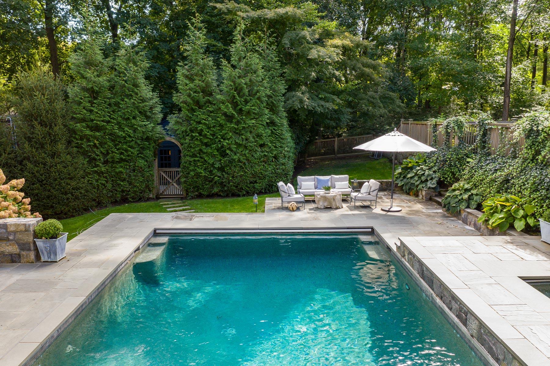 10 Meadowbrook Road Darien, CT 06820 - Photo 32 of 42 a swimming pool with outdoor seating and yard