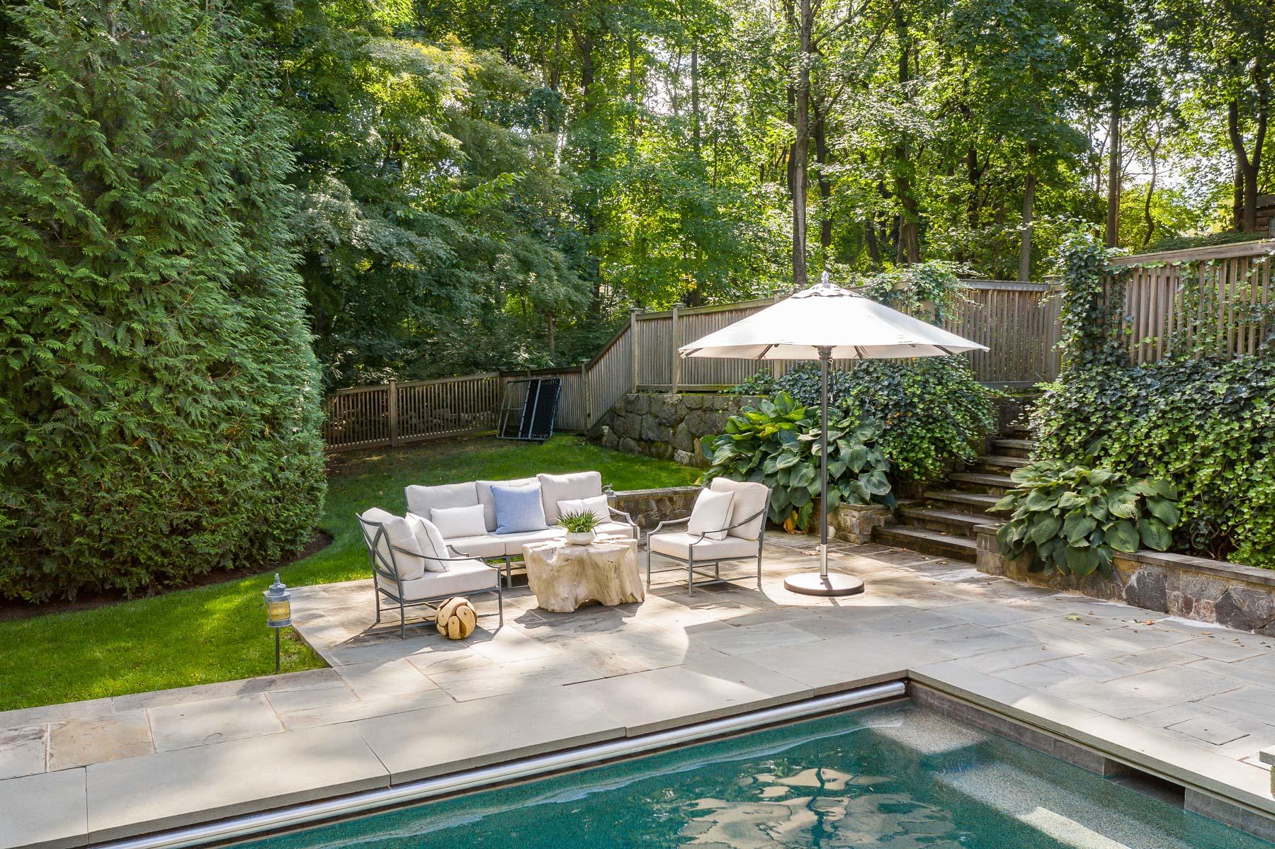 10 Meadowbrook Road Darien, CT 06820 - Photo 33 of 42 a view of a patio with chairs and a small yard