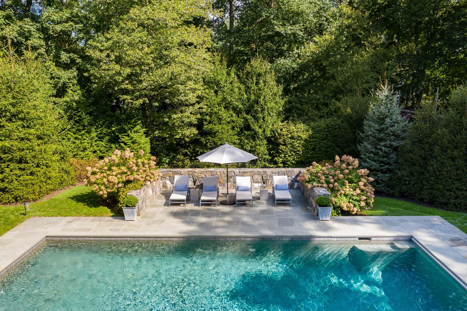 10 Meadowbrook Road Darien, CT 06820 - Photo 5 of 42 a house with trees in front of it