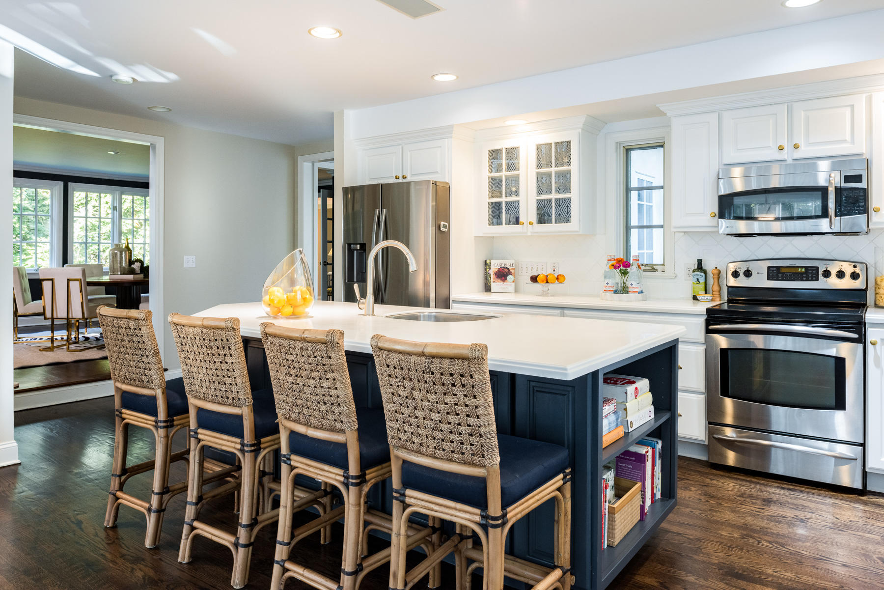 10 Meadowbrook Road Darien, CT 06820 - Photo 9 of 42 a kitchen with stainless steel appliances a stove a sink a microwave a dining table and chairs