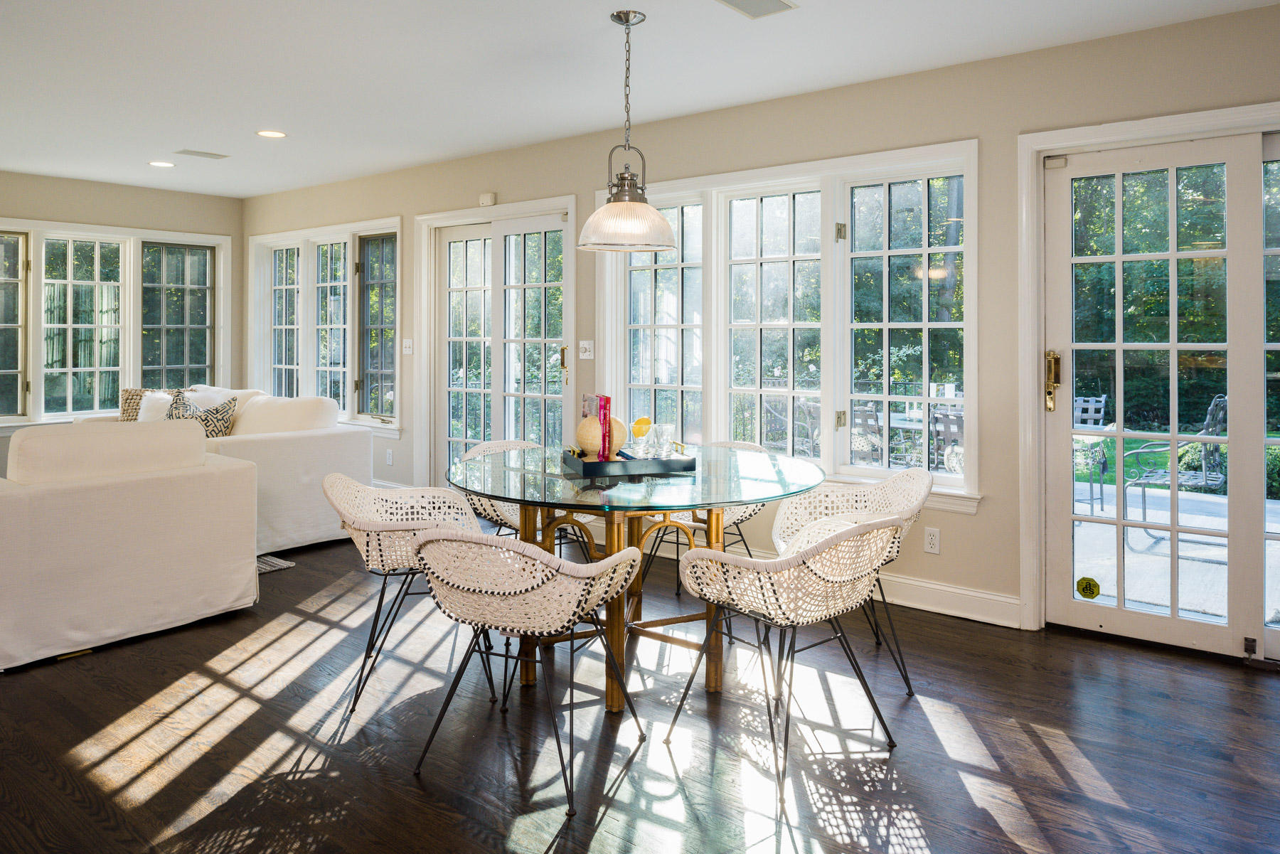 10 Meadowbrook Road Darien, CT 06820 - Photo 10 of 42 a dining room with furniture wooden floor and a chandelier