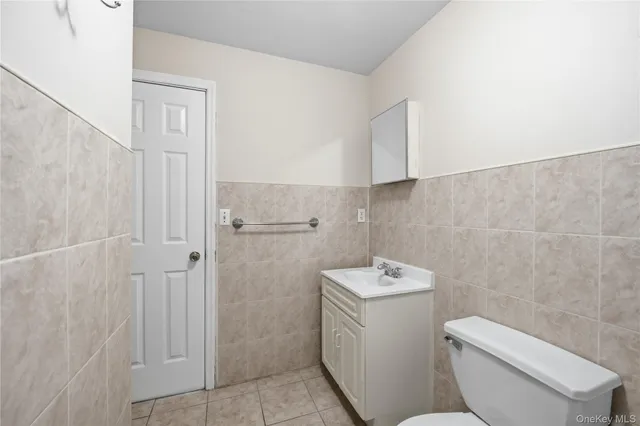 a bathroom with a toilet sink and shower