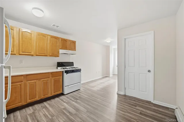 a kitchen with stainless steel appliances granite countertop a stove and a sink