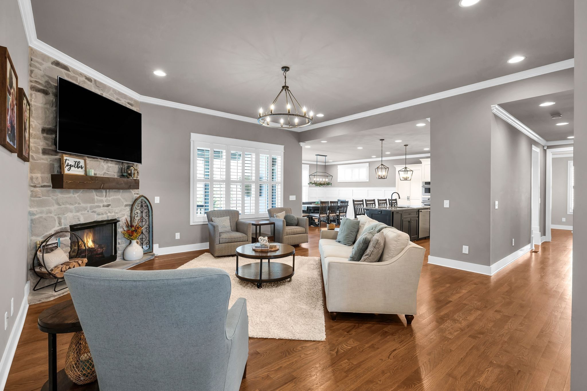 1032 Abbey Rd Way Spring Hill, TN 37174 - Photo 11 of 51 a living room with fireplace furniture and a flat screen tv