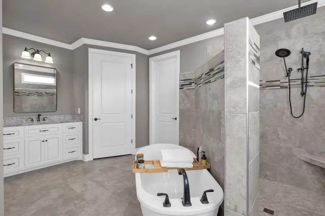 a bathroom with a shower and a sink