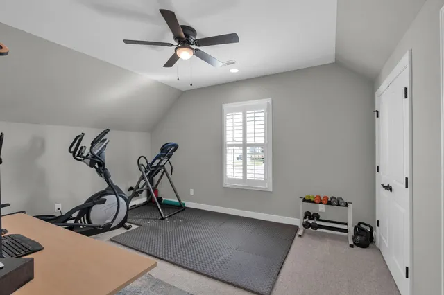 a view of a room with gym equipment and a window