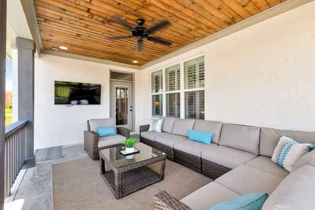 a view of a swimming pool with a patio