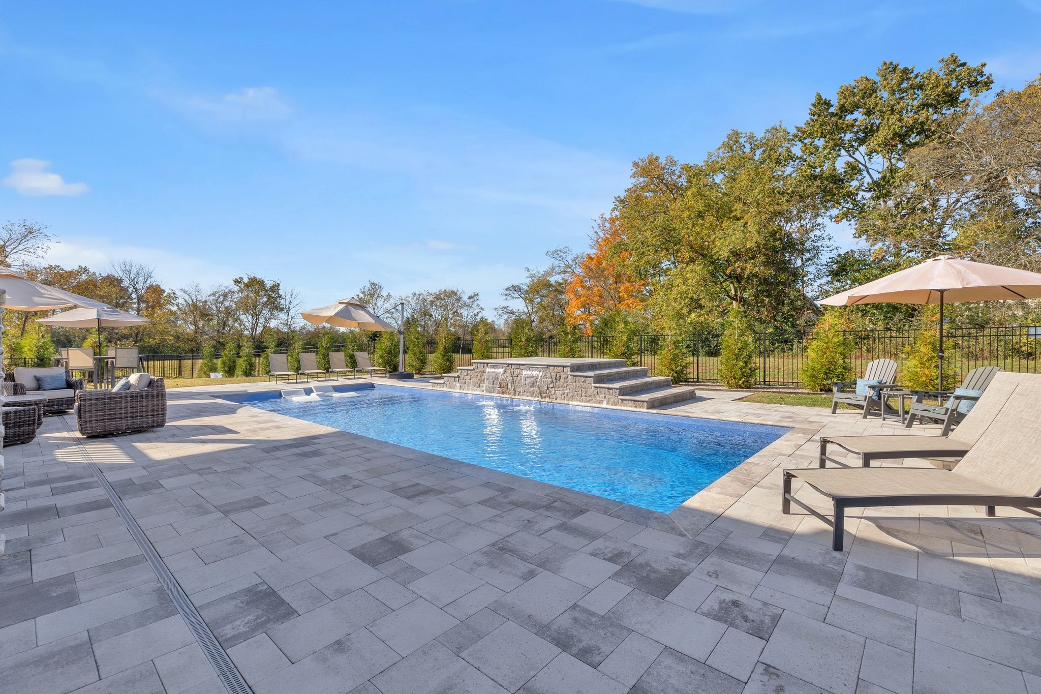 1032 Abbey Rd Way Spring Hill, TN 37174 - Photo 43 of 51 a view of a swimming pool with a lounge chair and a small yard