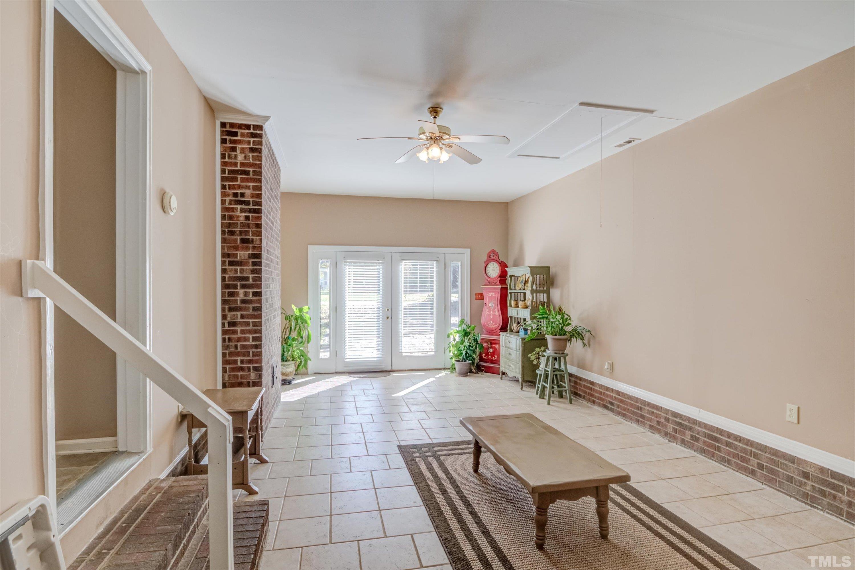 5149 Shield Circle Raleigh, NC 27603 - Photo 25 of 41 a living room with furniture and a potted plant