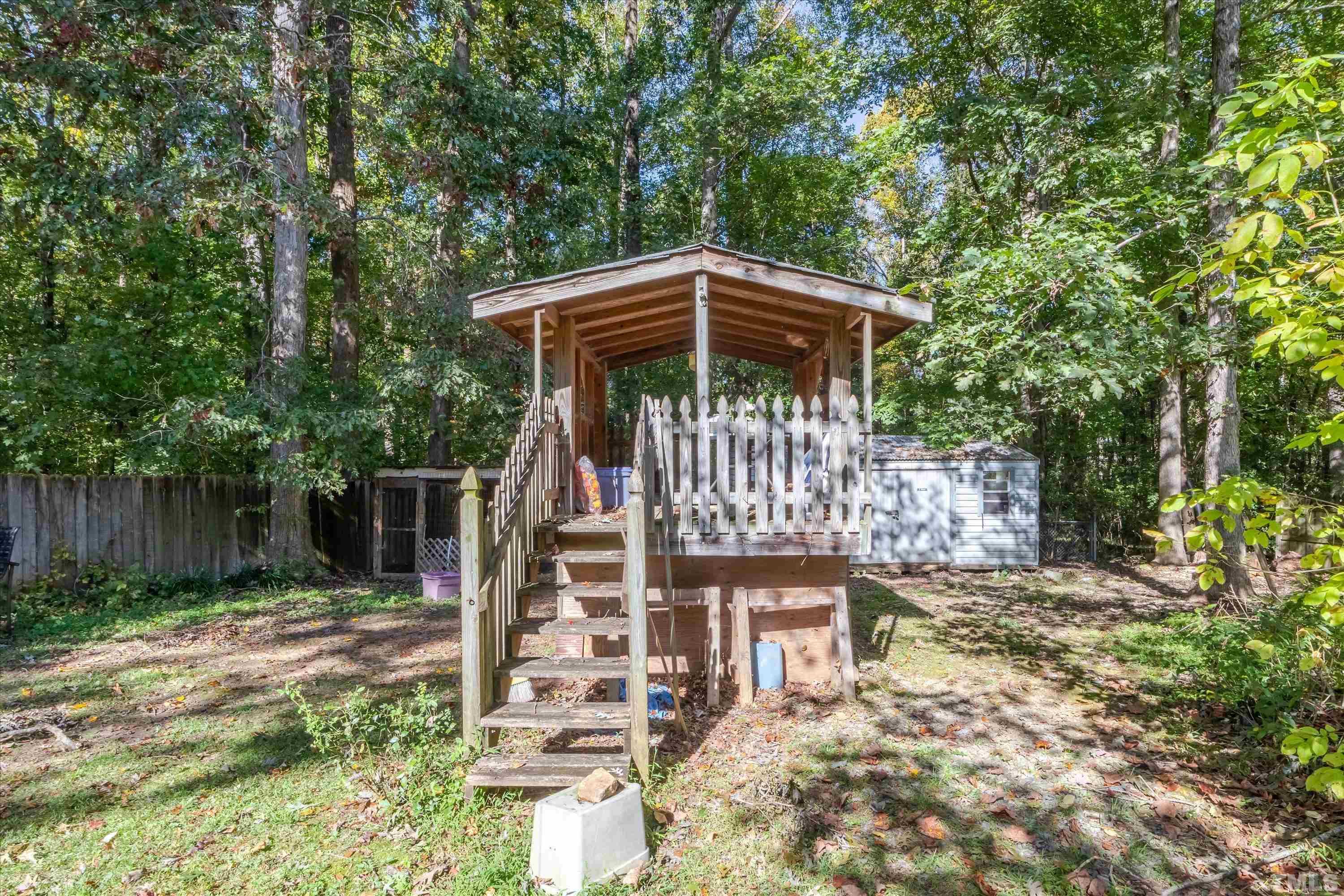 5149 Shield Circle Raleigh, NC 27603 - Photo 40 of 41 a view of a chair and table in the backyard