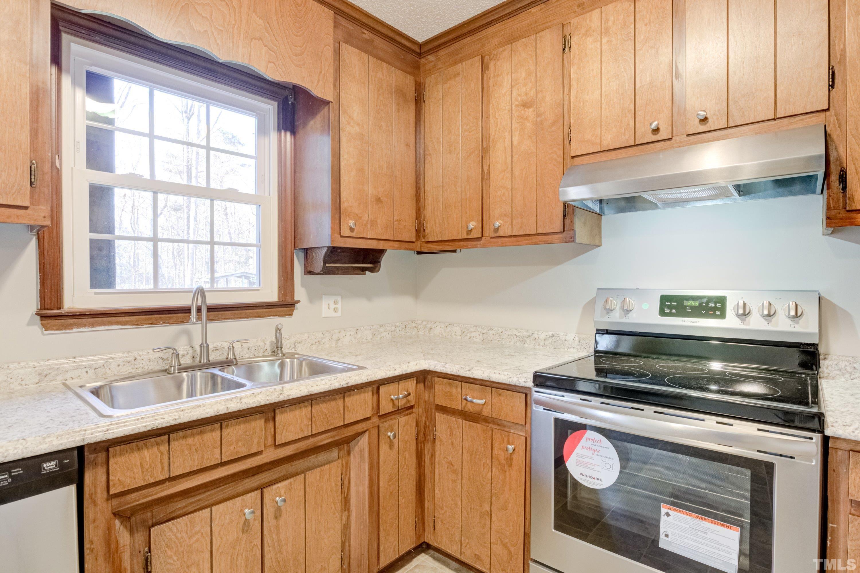 5149 Shield Circle Raleigh, NC 27603 - Photo 10 of 41 a kitchen with a stove and a sink