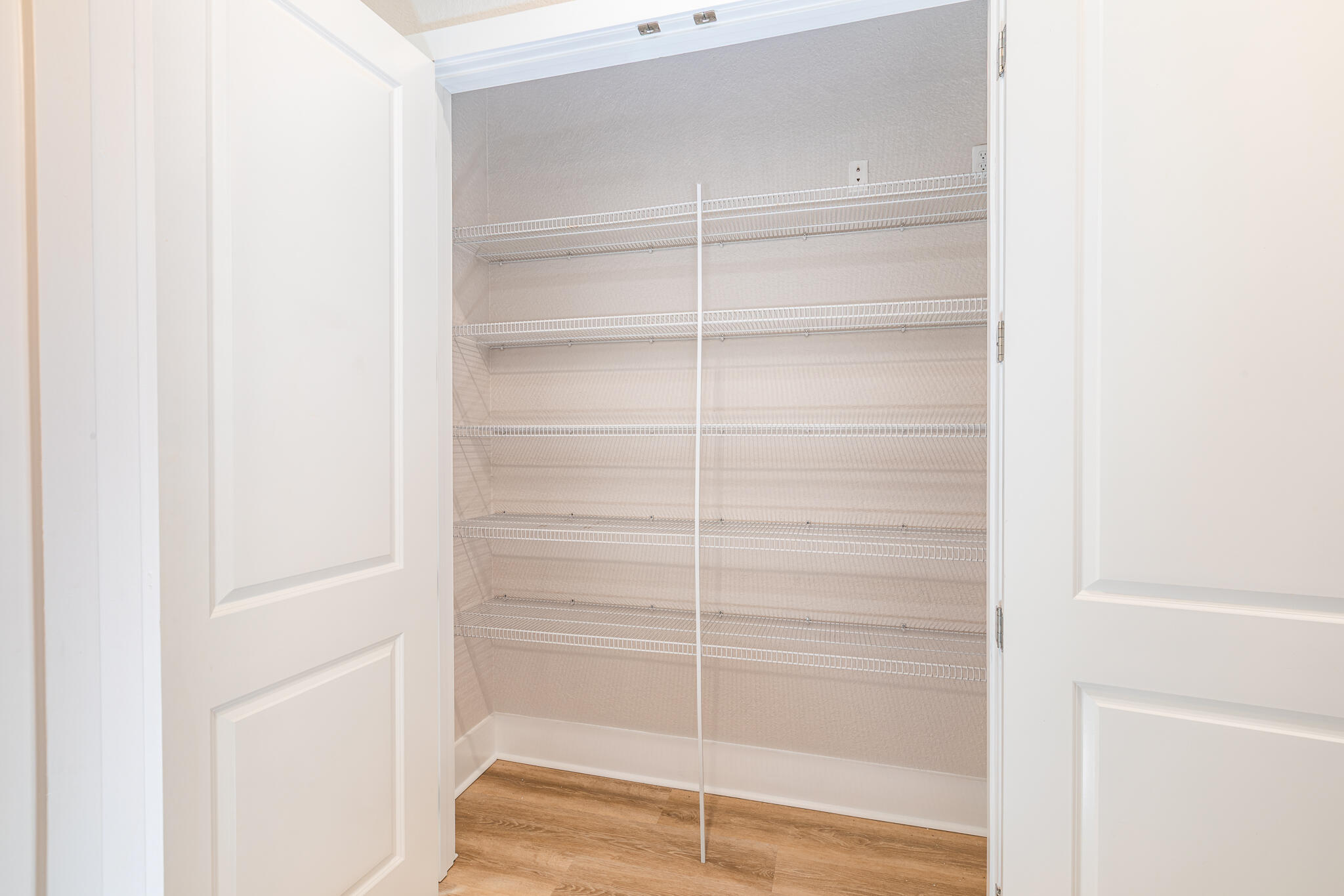 995 Airport Road, Unit 54 Destin, FL 32541 - Photo 11 of 31 a view of walk in closet with empty racks