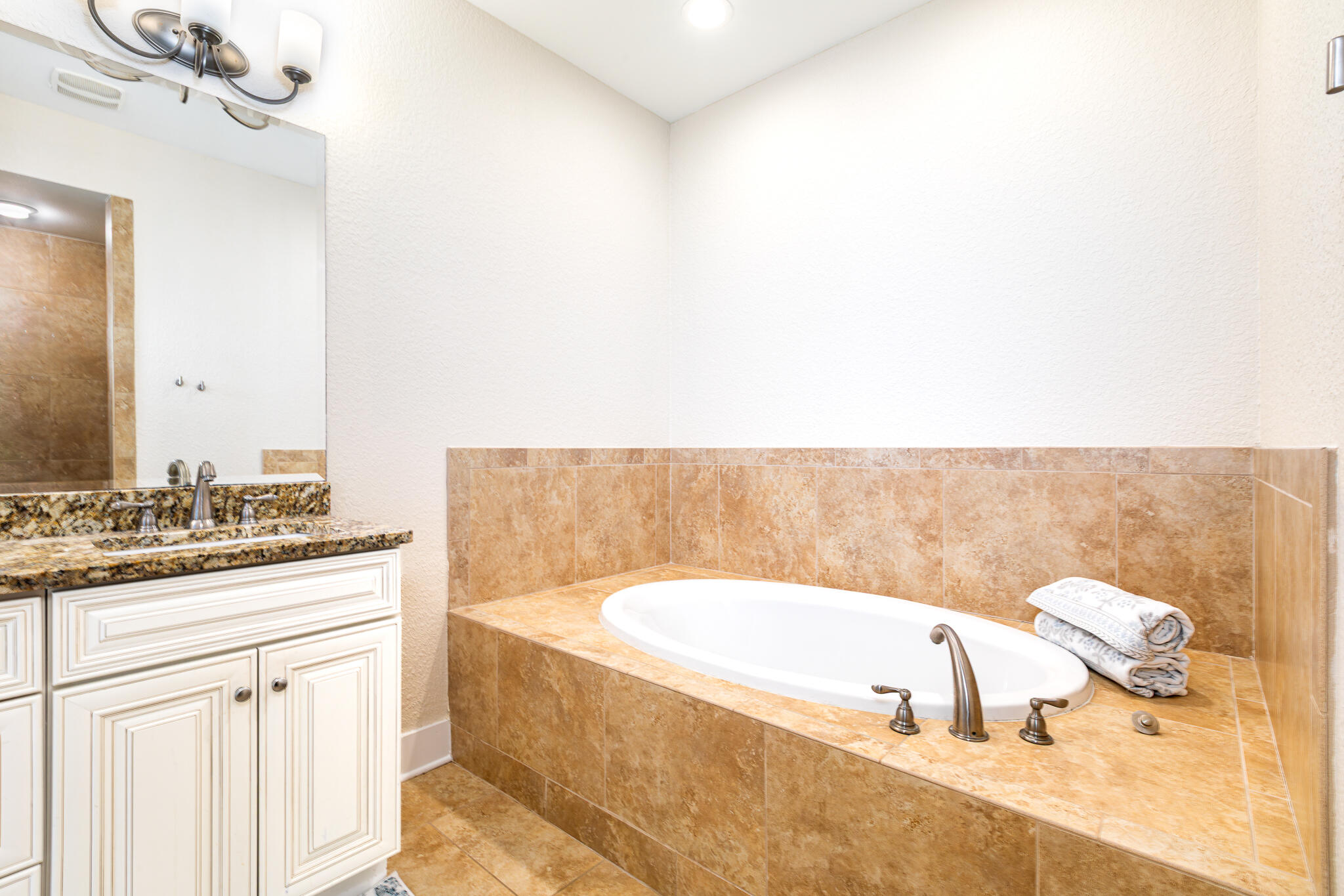 995 Airport Road, Unit 54 Destin, FL 32541 - Photo 19 of 31 a bathroom with a bathtub and a sink