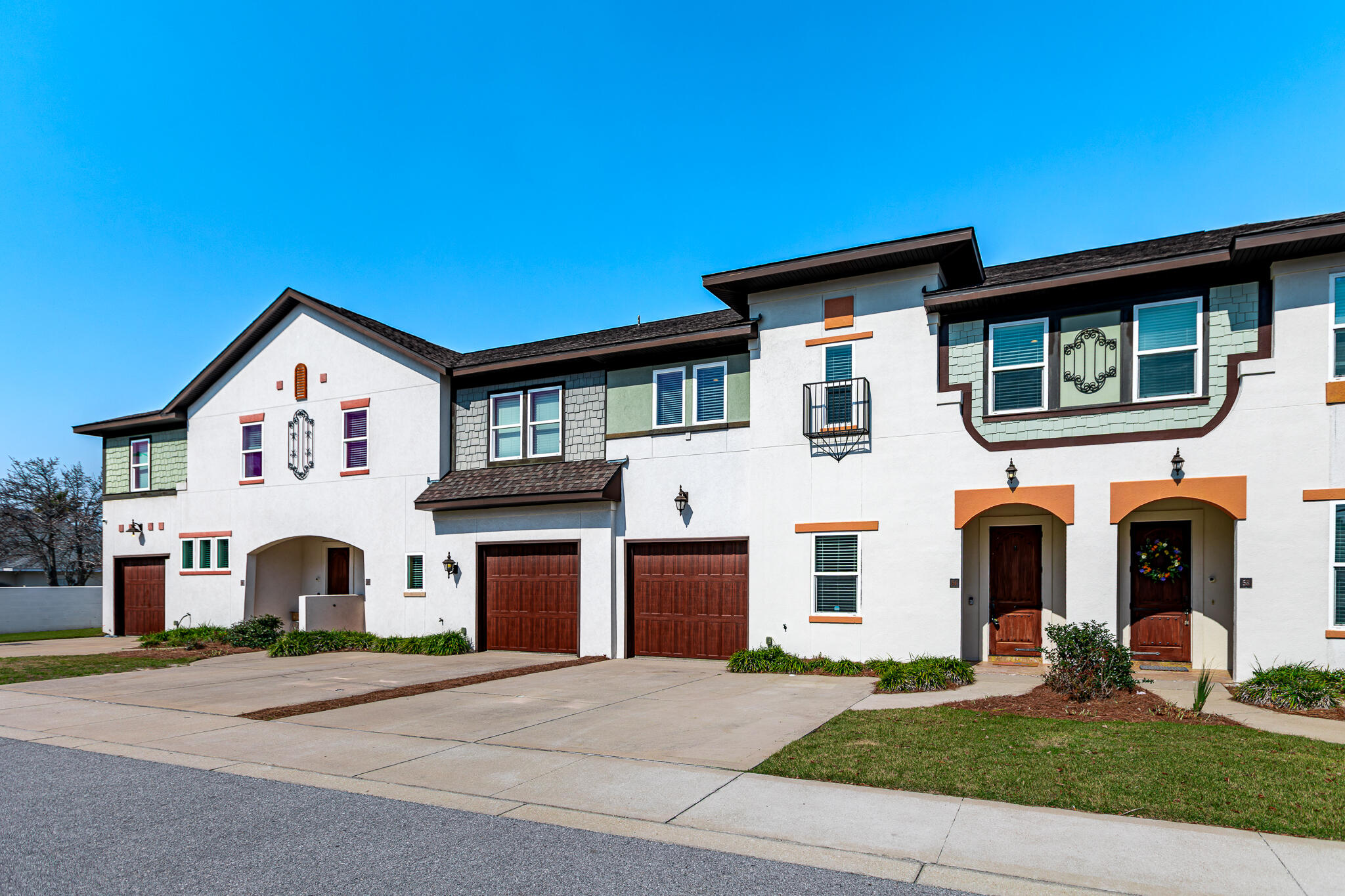 995 Airport Road, Unit 54 Destin, FL 32541 - Photo 2 of 31 a view of a house with a yard and garage