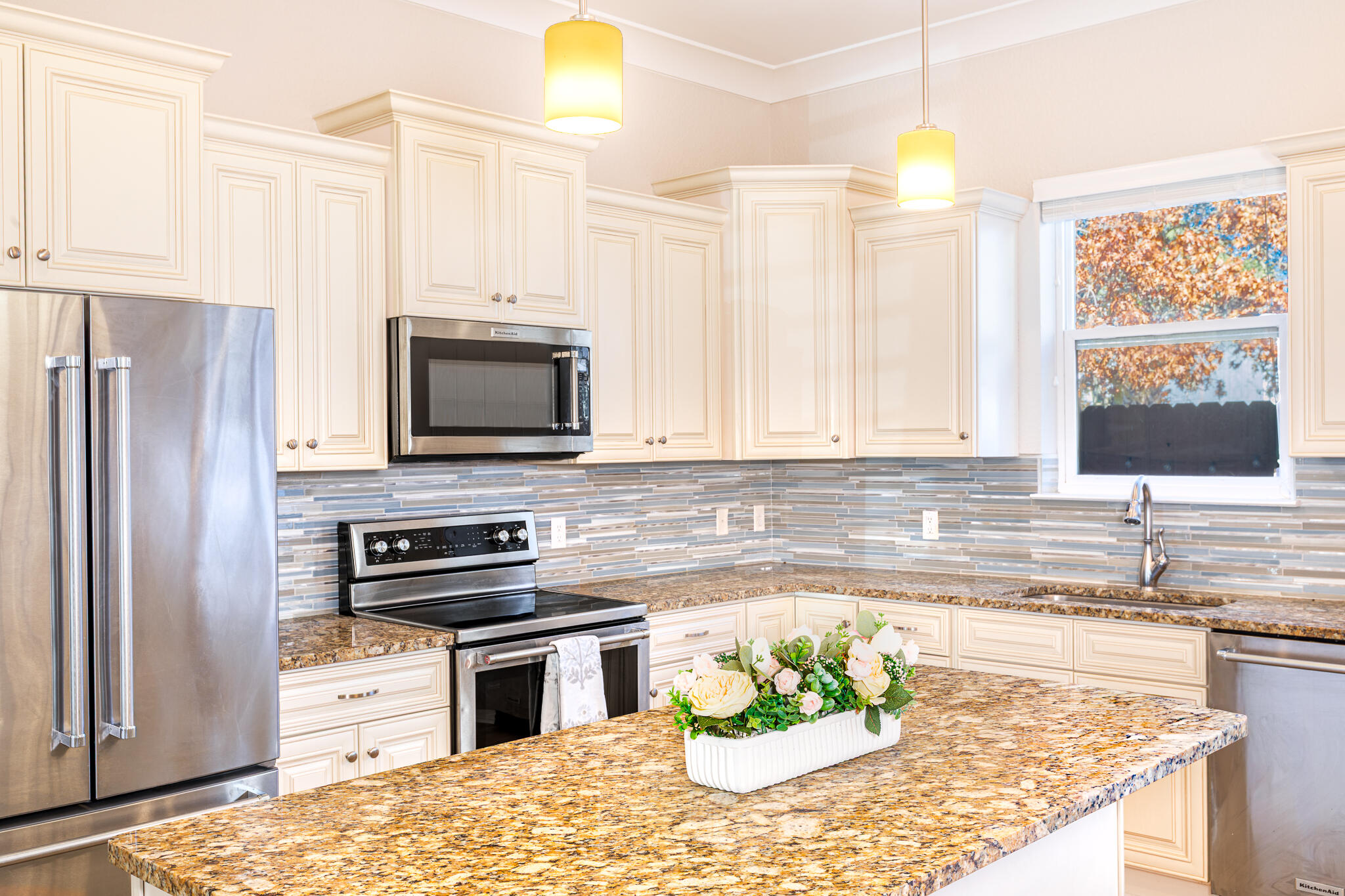 995 Airport Road, Unit 54 Destin, FL 32541 - Photo 7 of 31 a kitchen with a stove a sink and a refrigerator