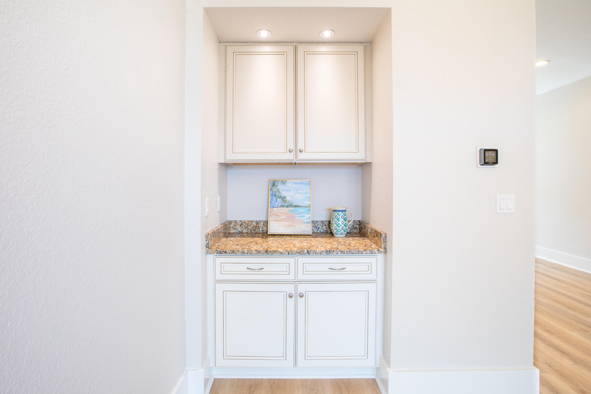 995 Airport Road, Unit 54 Destin, FL 32541 - Photo 10 of 31 a kitchen with granite countertop white cabinets and white appliances