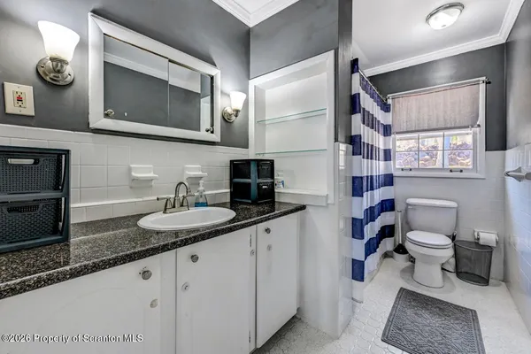 a kitchen with cabinets and stainless steel appliances