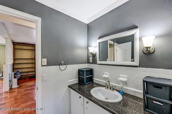 a kitchen with stainless steel appliances a sink stove and cabinets