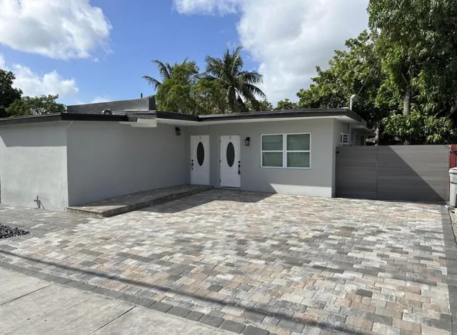 a house with trees in the background
