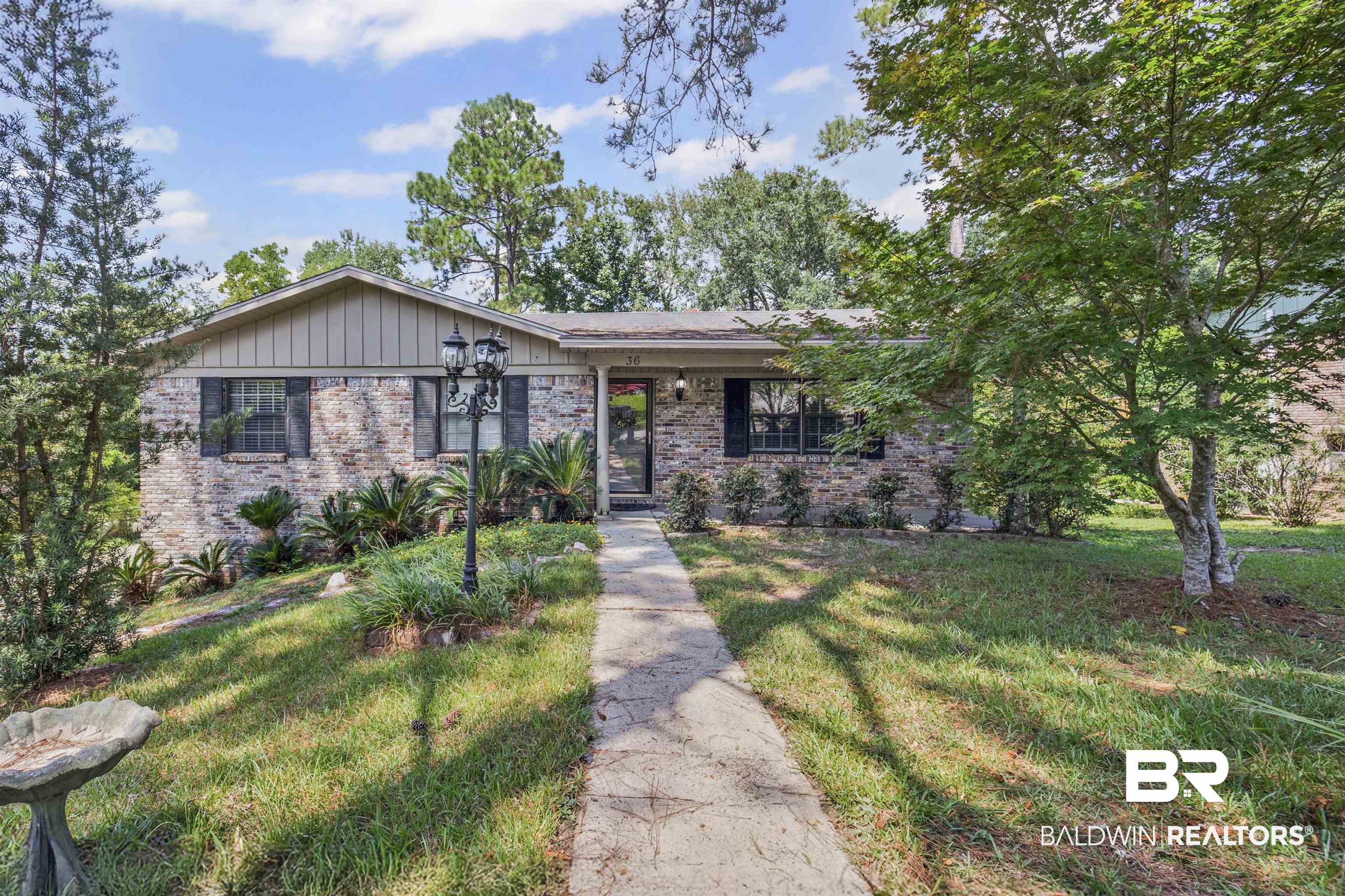 36 Ridgeview Drive Mobile, AL 36611 - Photo 1 of 20 View of front of home featuring brick siding and a front yard
