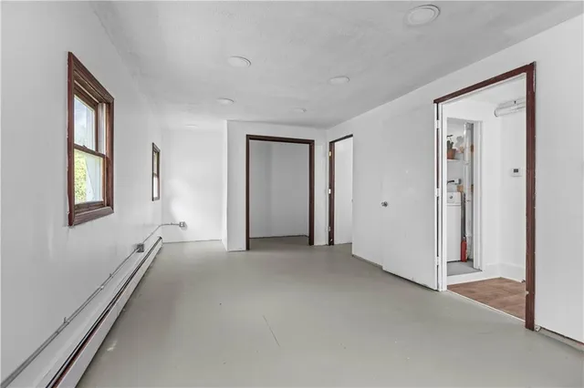 a view of empty room with windows