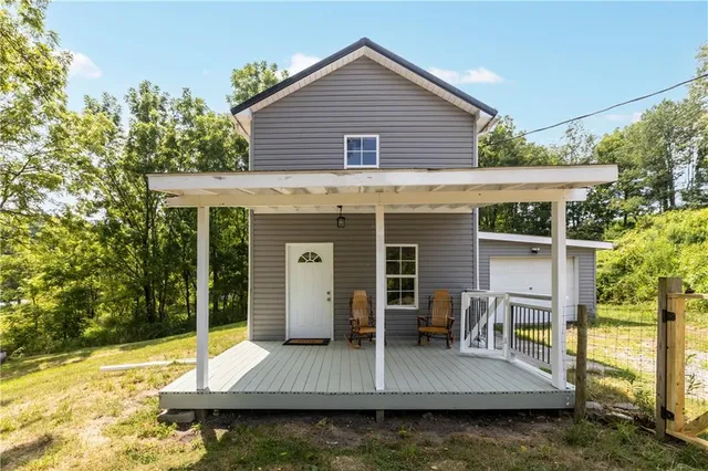 swimming pool view with a seating space