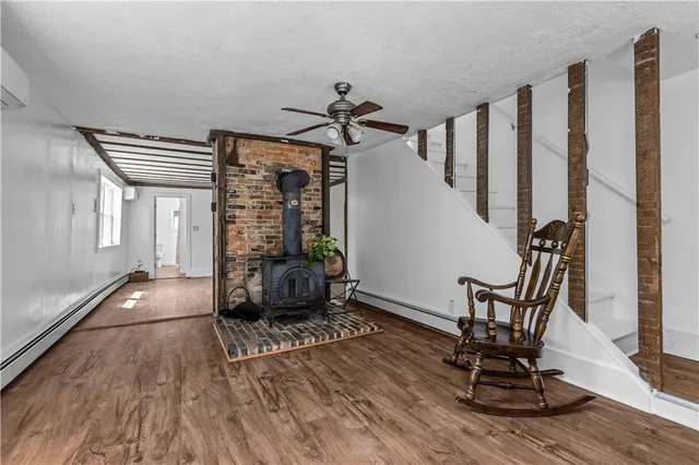 a view of a livingroom with furniture and staircase