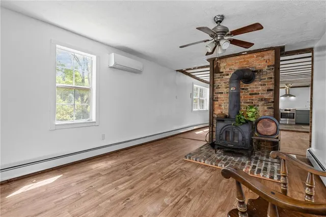 a living room with furniture a window and a rug