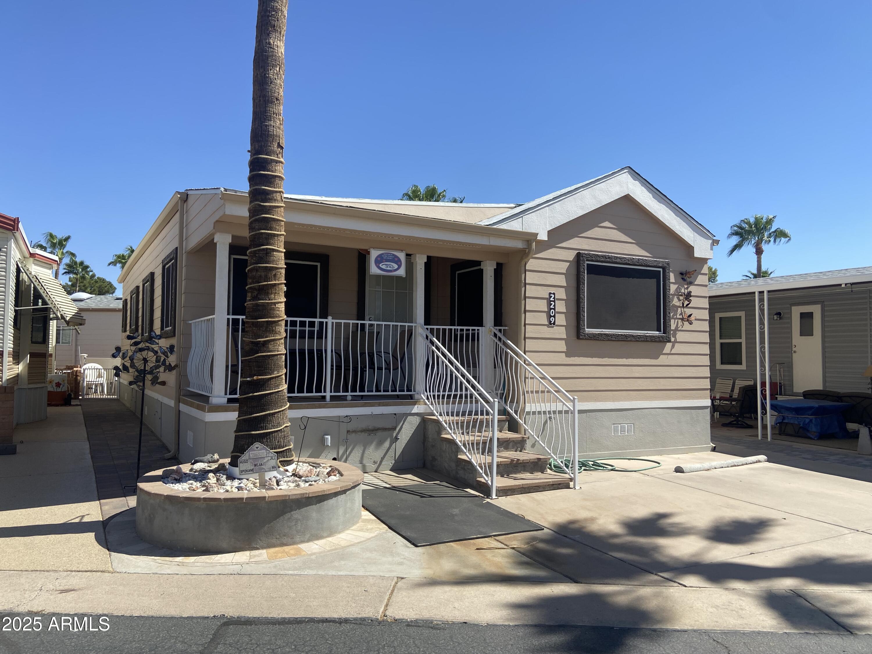 2209 West Klamath Avenue Apache Junction, AZ 85119 - Photo 1 of 30 a front view of a house with a yard