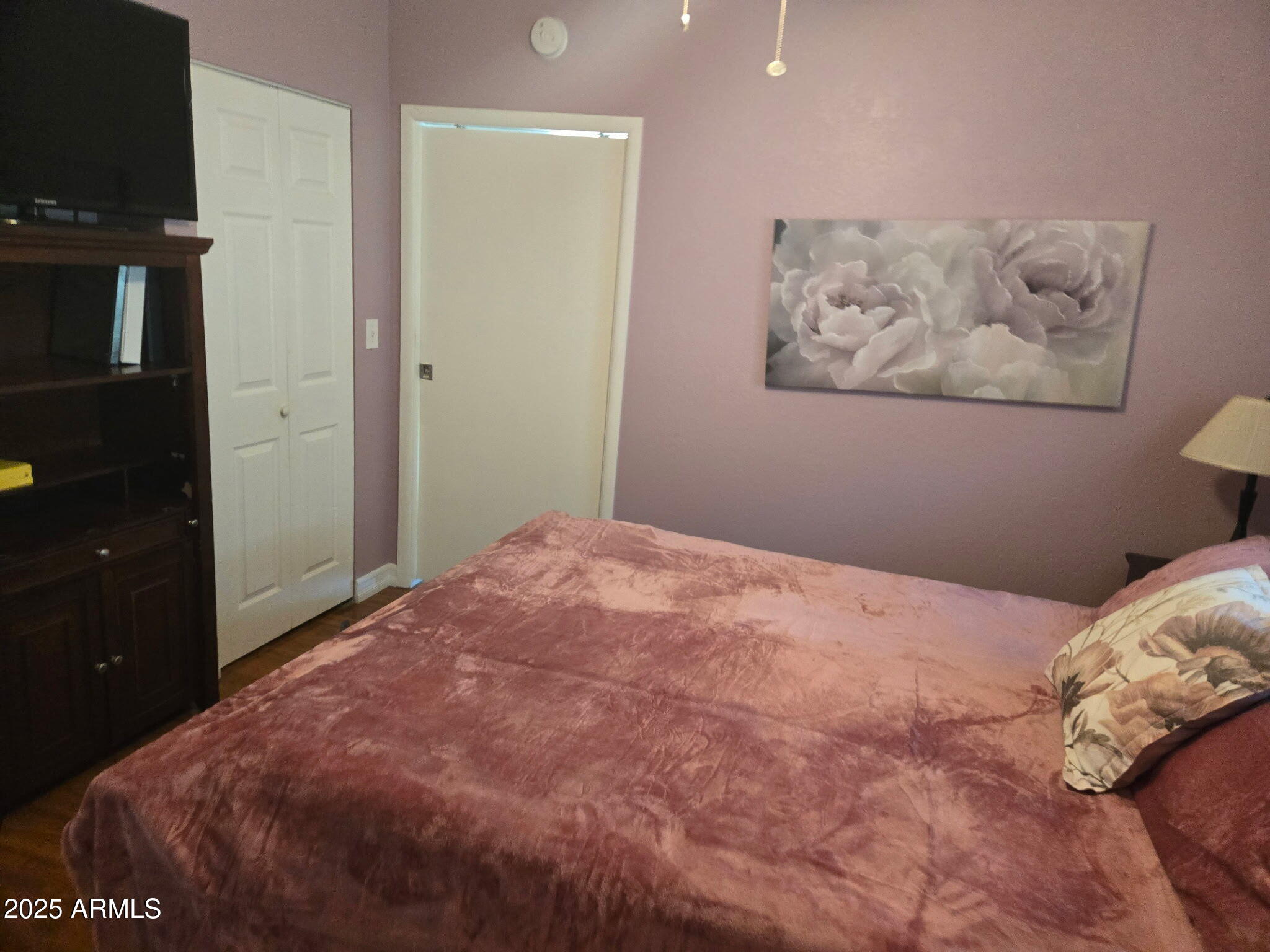 2209 West Klamath Avenue Apache Junction, AZ 85119 - Photo 20 of 30 a bedroom with a bed and a television