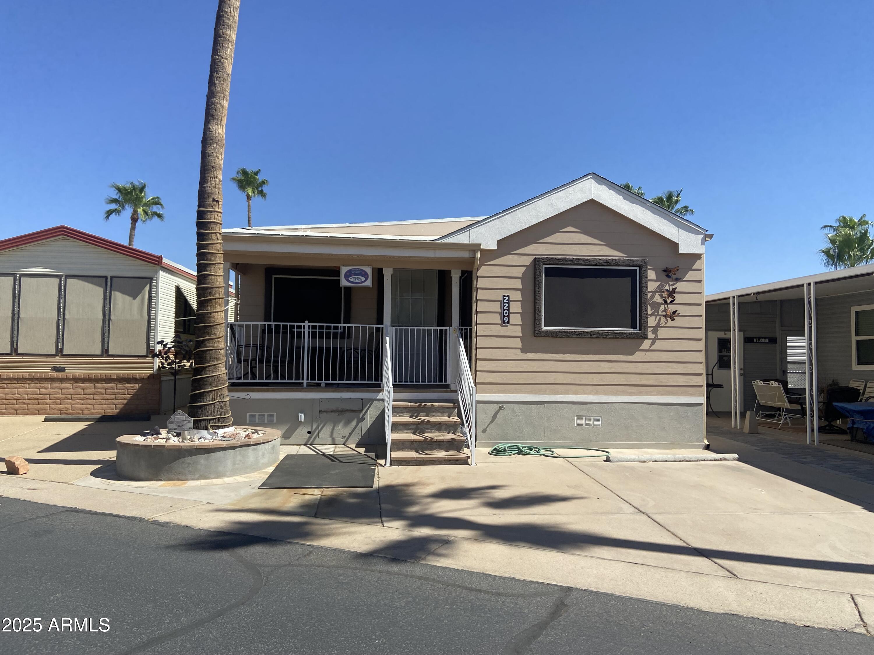 2209 West Klamath Avenue Apache Junction, AZ 85119 - Photo 30 of 30 a front view of a house with a garage